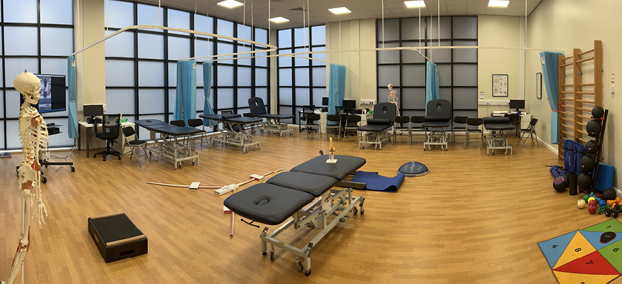 wide shot of the sports rehab clinic with equipment out