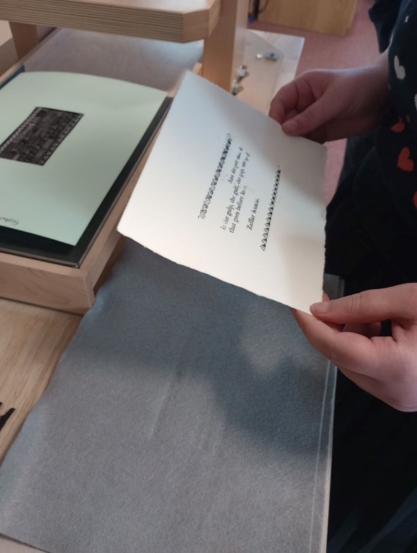 Person holding printed paper