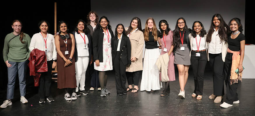 Students gathered on stage to present their creative work.