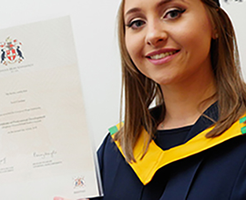 Graduate holding certificate