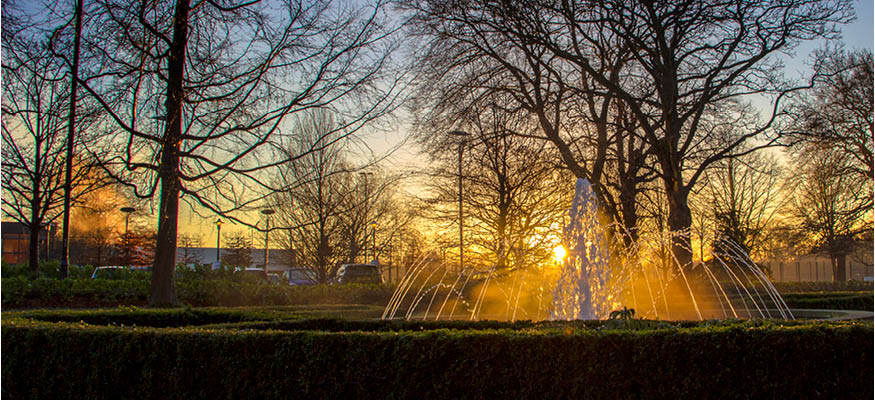Beautiful sunrise behind the fountain