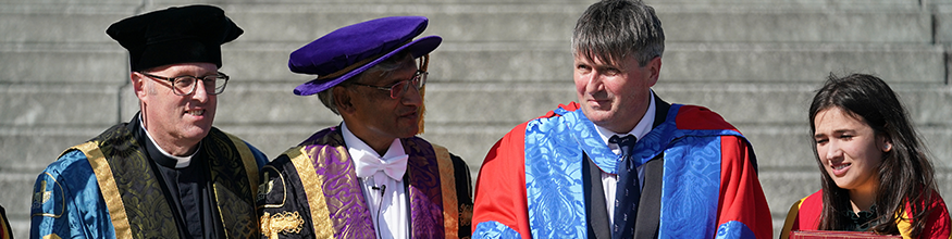 Simon Armitage poses with the Vice Chancellor and others at the graduation ceremony