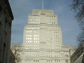 Photo of a large white building with a dusky sky backdrop