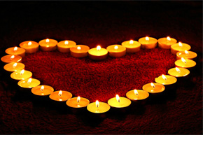 heart surrounded by candles
