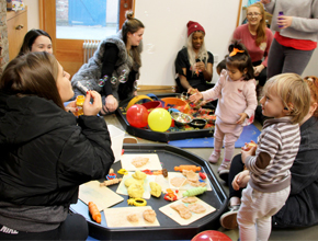 Parents playing with toddlers