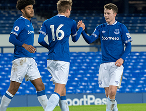 young everton team celebrate in an empty stadium