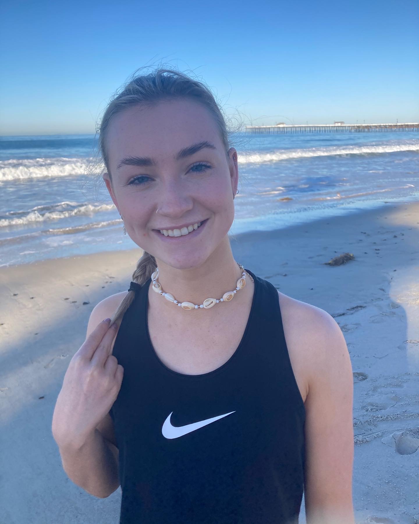 image of orlagh goodwin smiling while at the beach