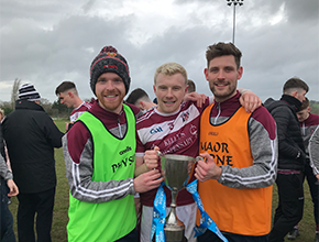 Two GAA players celebrating with trophy