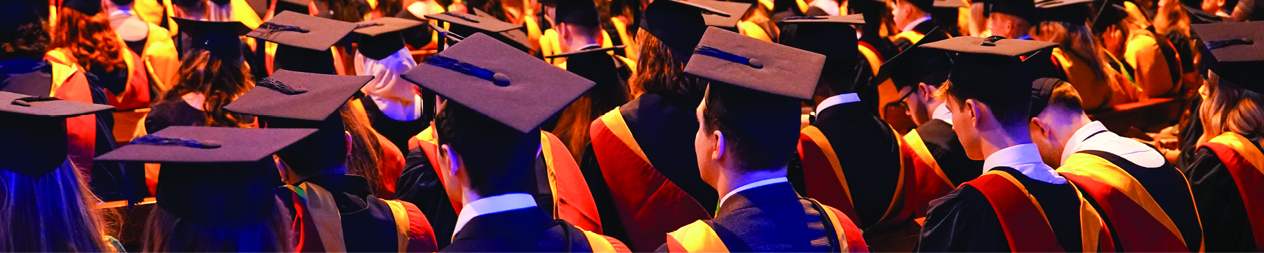 Students sit in cathedral at their Graduation ceremony