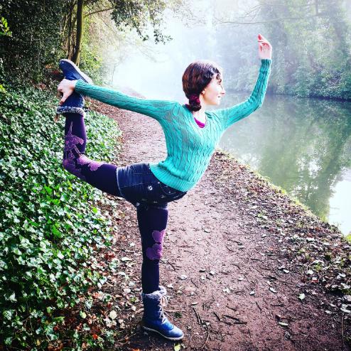 Person doing yoga in the woods