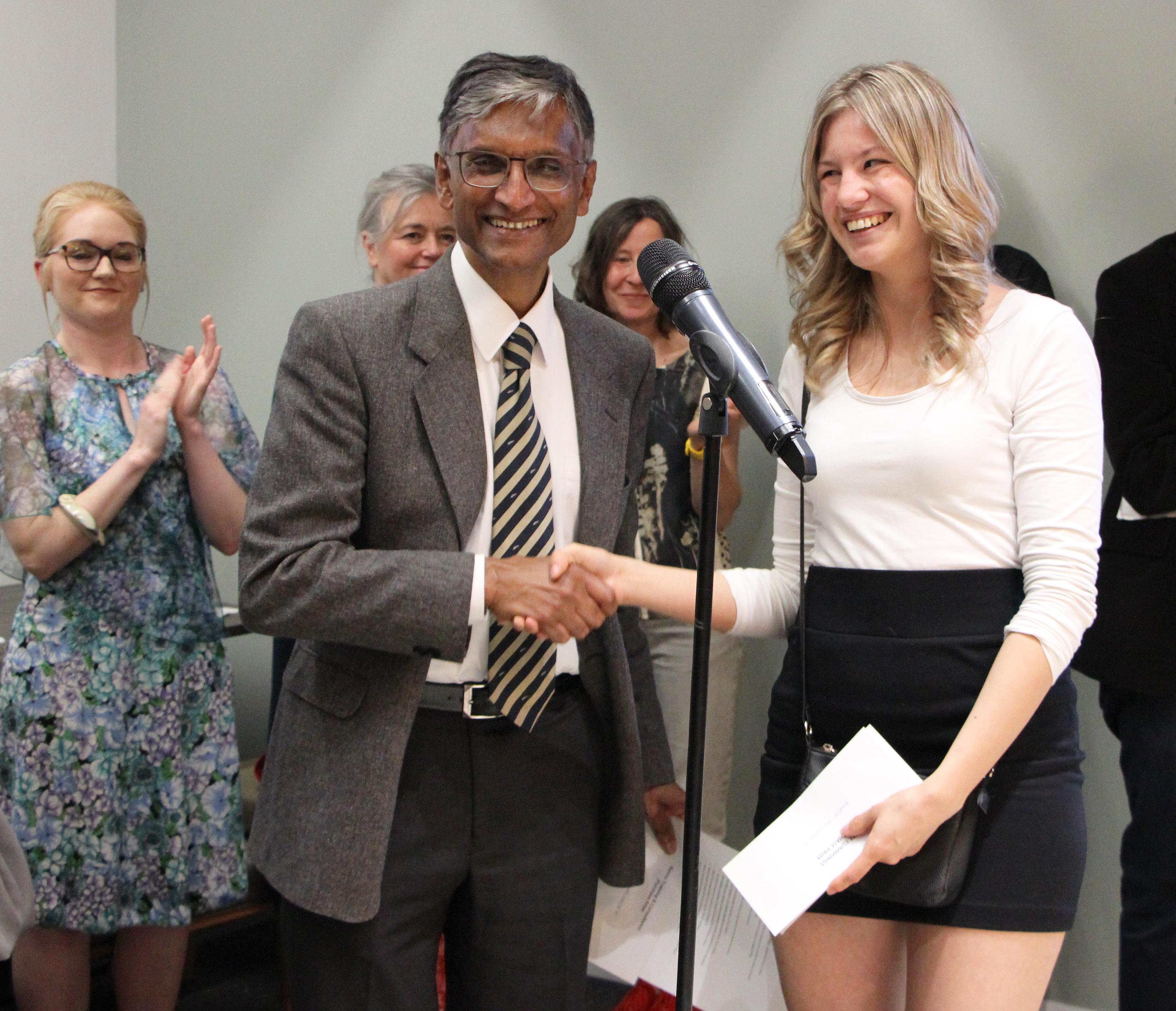 Professor Pillay presents a student award