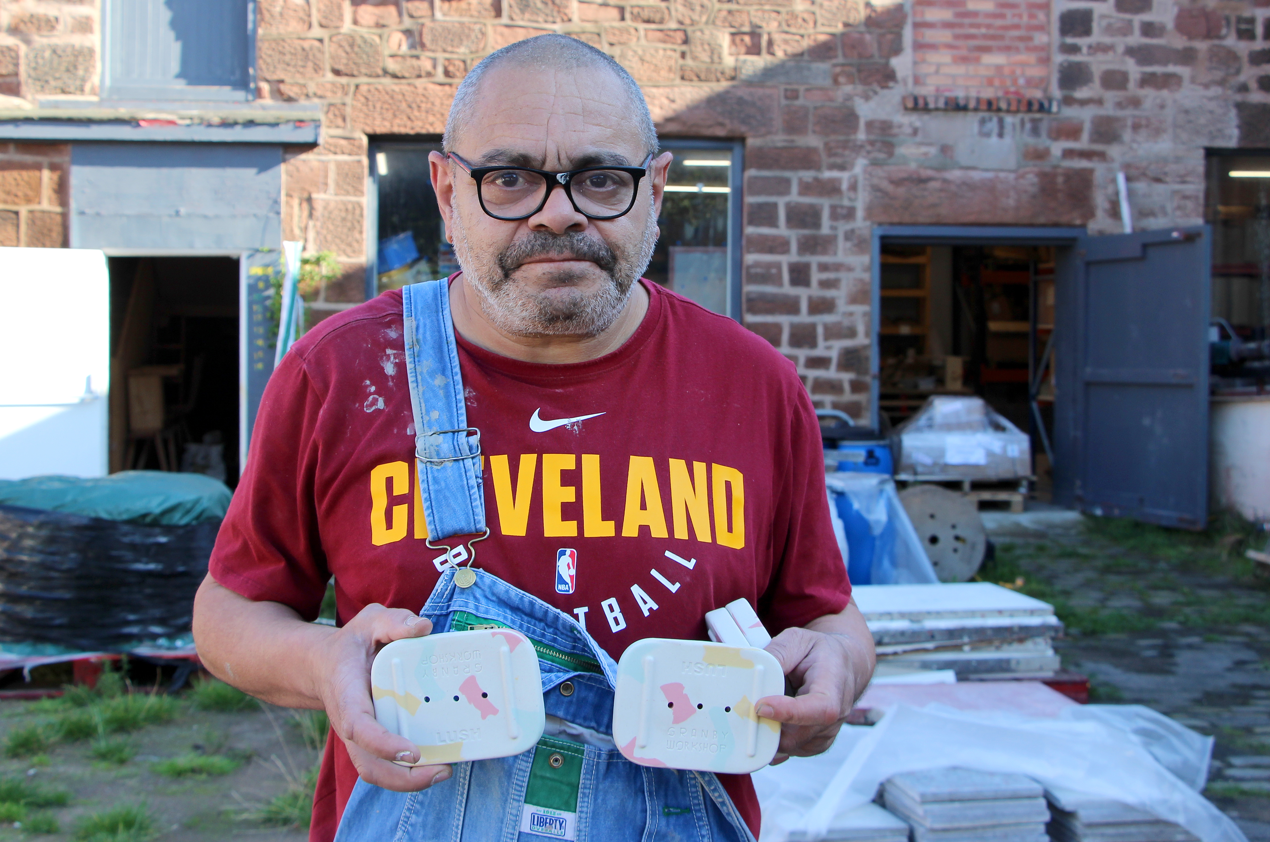 Man holding ceramics