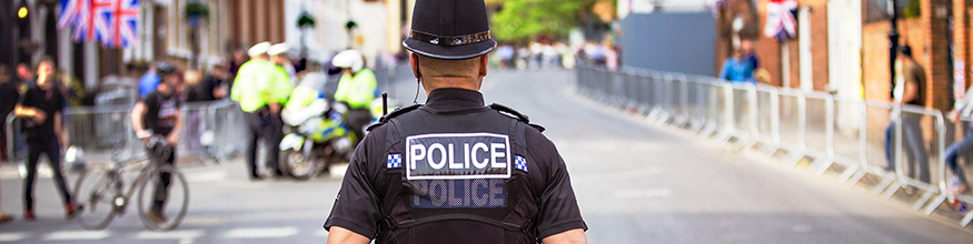 Abstract photo of Police Officer walking through the streets