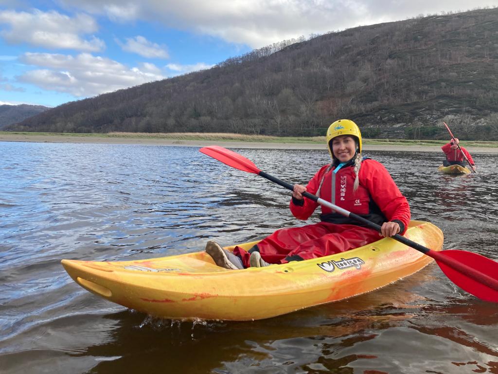 female student kayaking at plas caerdeon