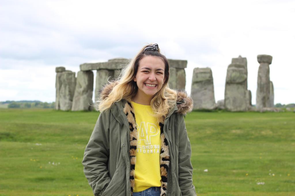Person standing in front of Stonehenge