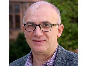 headshot of staff member outside in the spring air