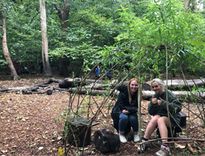 students smiling in the woods