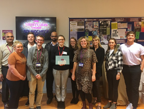 PGDE students standing and smiling for a photo