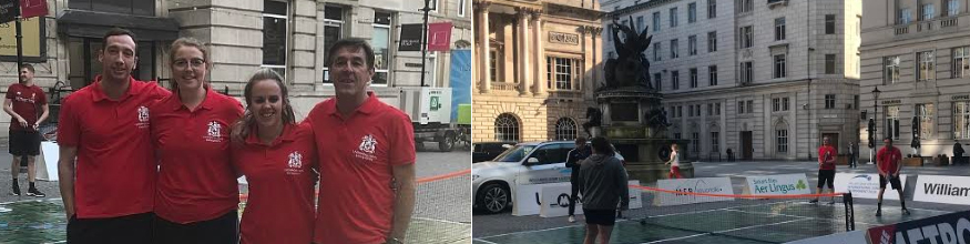 staff playing tennis in city centre