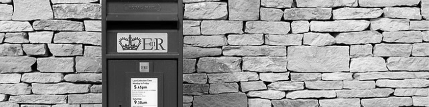 black and white image of a postbox