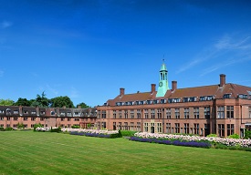 The HCA building and rectors lawn on a sunny day