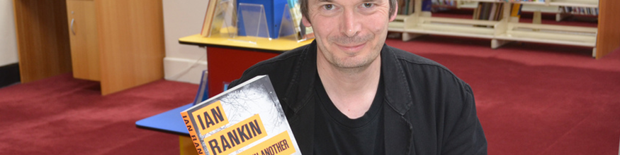 Author Ian Rankin showcasing his book