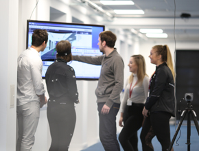 lecturer showing students work on screen