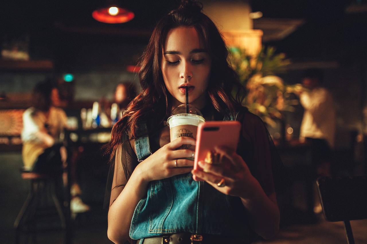 woman drinking coffee in bar