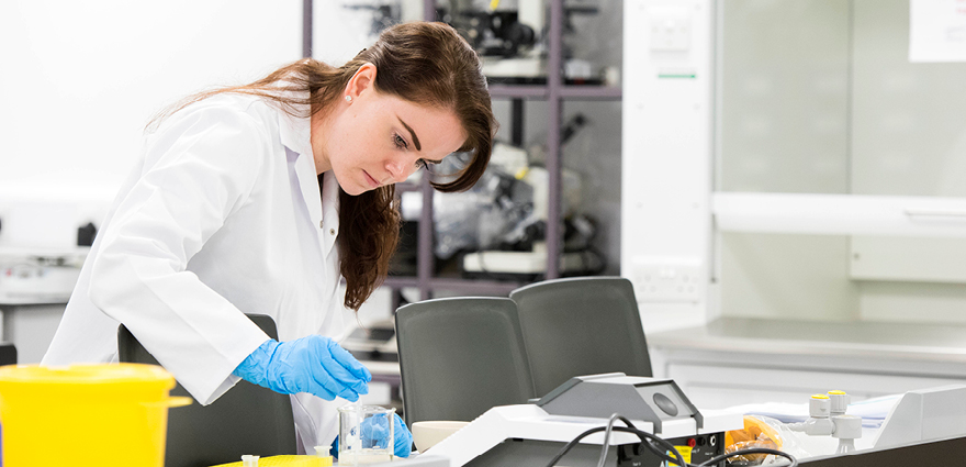 Student working in lab with chemicals