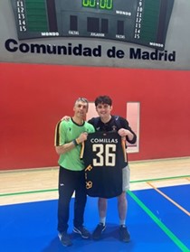 Two people holding football shirt