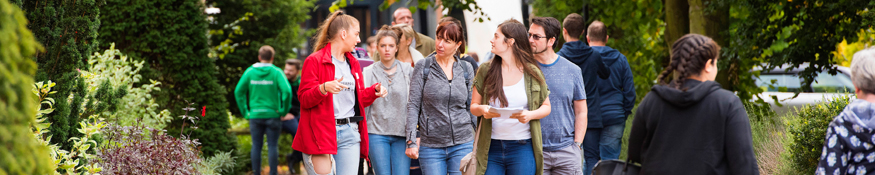 Student showing guests around campus